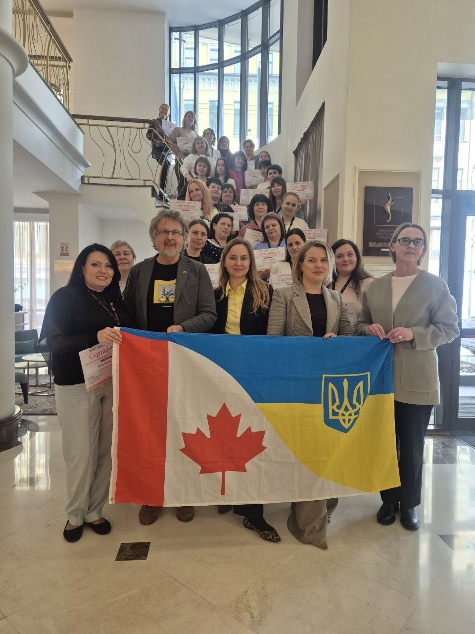 CUPY training participants with the Canada and Ukraine flag in Kyiv, March to April 2026